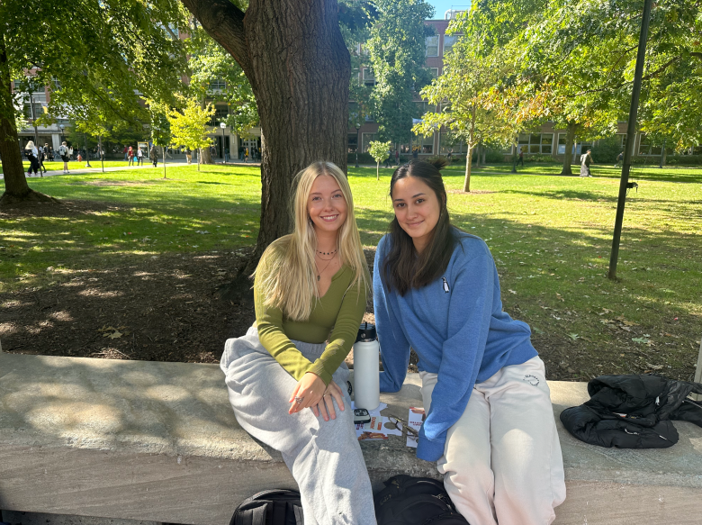 Hailey Storey (left) and Haelee Christman (right) sit on a table at the University of Michigan, Oct. 8, 2024.